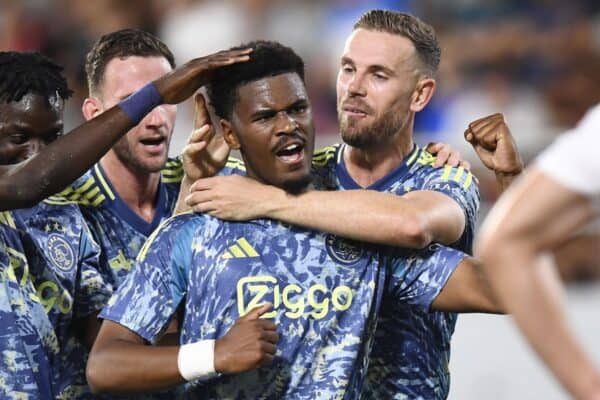 Ajax player Jorrel Hato scores 1-2 and celebrates with Jordan Henderson and Ajax player Bertrand Traore